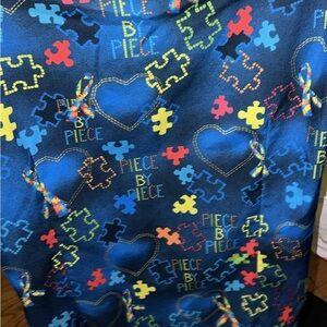 Colorful Puzzle Piece Scrub Top